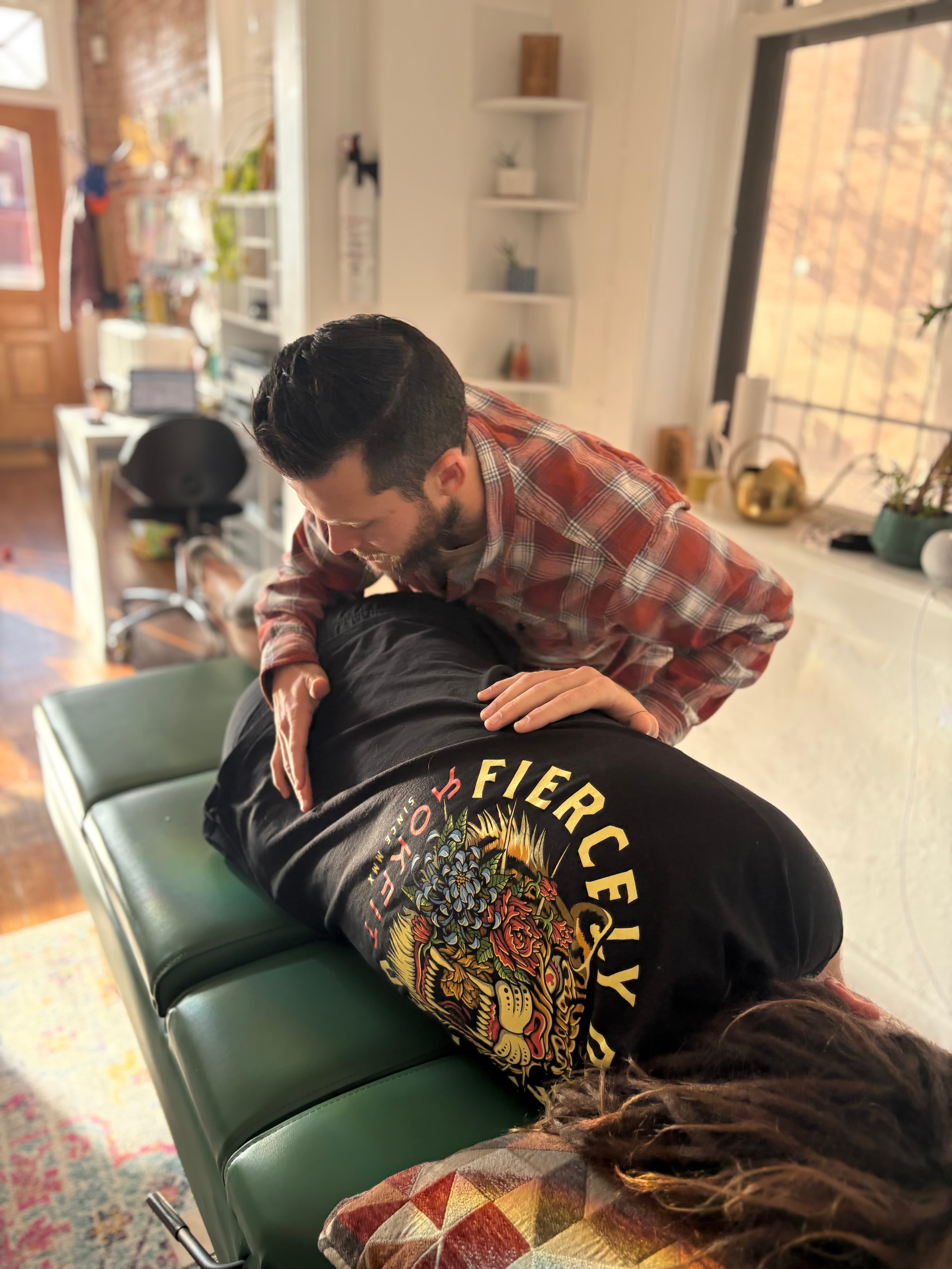 Dr. Brandon performing a chiropractic adjustment